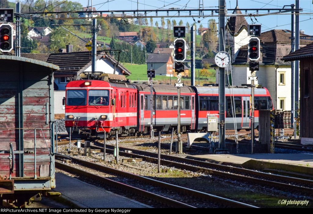 AB 11 leads a passenger train to the station